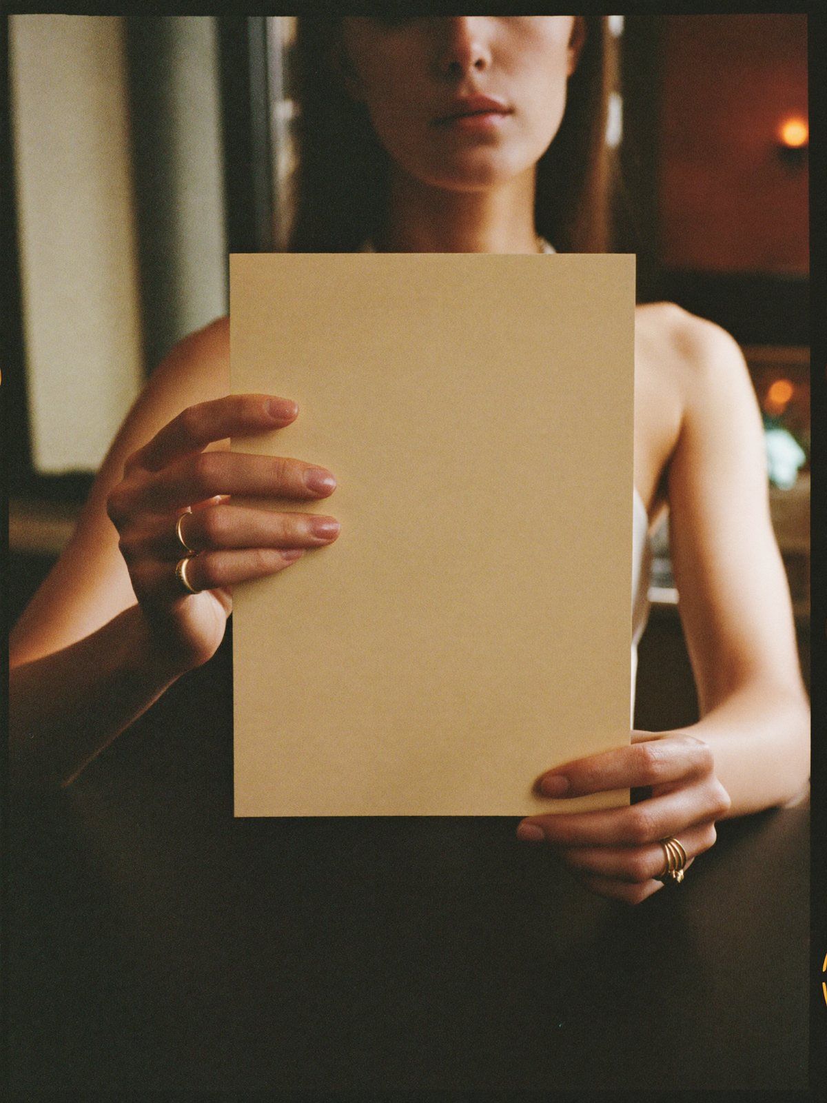 The Halloran house menu card held to camera — typeset live by the studio over the printed blank