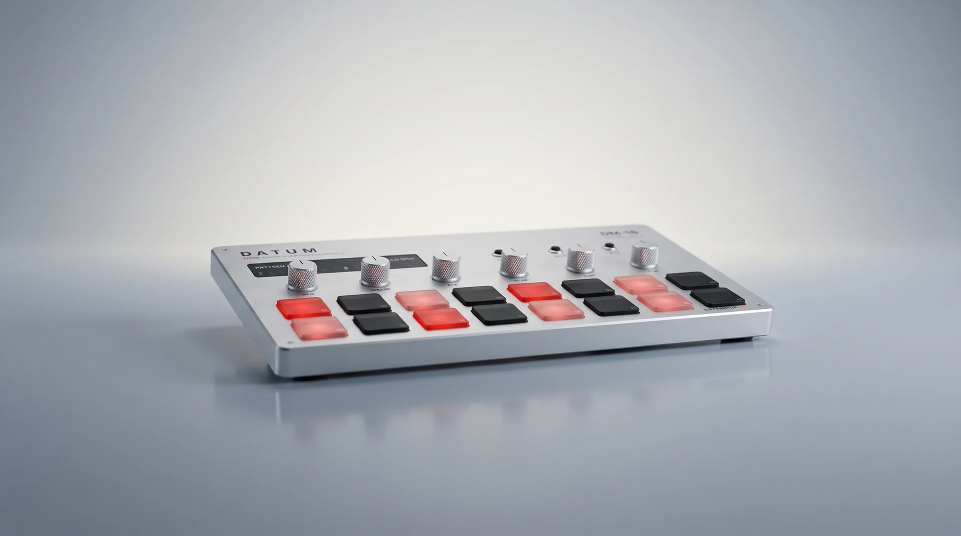 The DATUM DM-16 sixteen-step drum machine, photographed clean and modern on a soft ambient gradient.